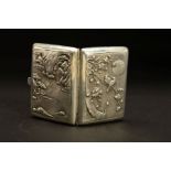 AN EARLY 20TH CENTURY CHINESE SILVER CIGARETTE CASE, of rectangular form, the front embossed with