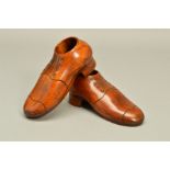 A PAIR OF 20TH CENTURY TREEN SHOES, with circular openings, length 16cm (2) (condition: some light