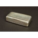 A GEORGE III RECTANGULAR SILVER SNUFF BOX, the whole exterior engine turned with horizontal bands,