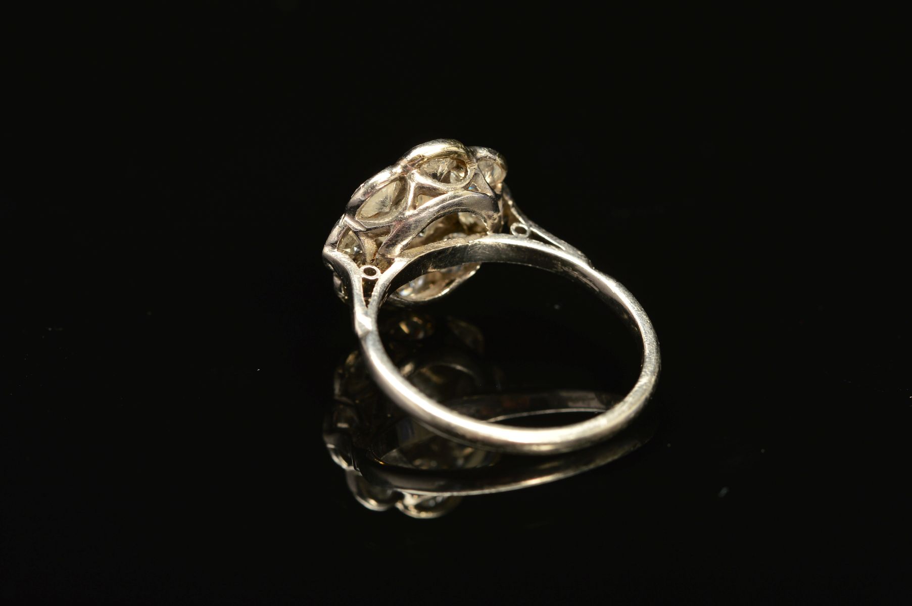 A DIAMOND CLUSTER RING, the central brilliant cut diamond within a surround of eight brilliant cut - Image 4 of 5