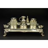 A GEORGE III SILVER SHAPED RECTANGULAR INKSTAND, fitted with a central taperstick with removable