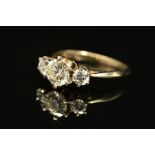 A MODERN THREE STONE DIAMOND RING, centre brilliant cut diamond estimated 1.60ct, colour assessed as