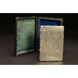 A VICTORIAN SILVER CARD CASE, of shaped rectangular form, foliate engraved decoration, blind
