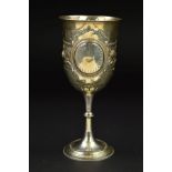 A VICTORIAN SILVER GOBLET, repousse and punched foliate, scroll and swag decoration, beaded foot