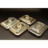 FOUR LATE 19TH/EARLY 20TH CENTURY SILVER PLATED ENTREE DISHES AND COVERS, comprising a pair with