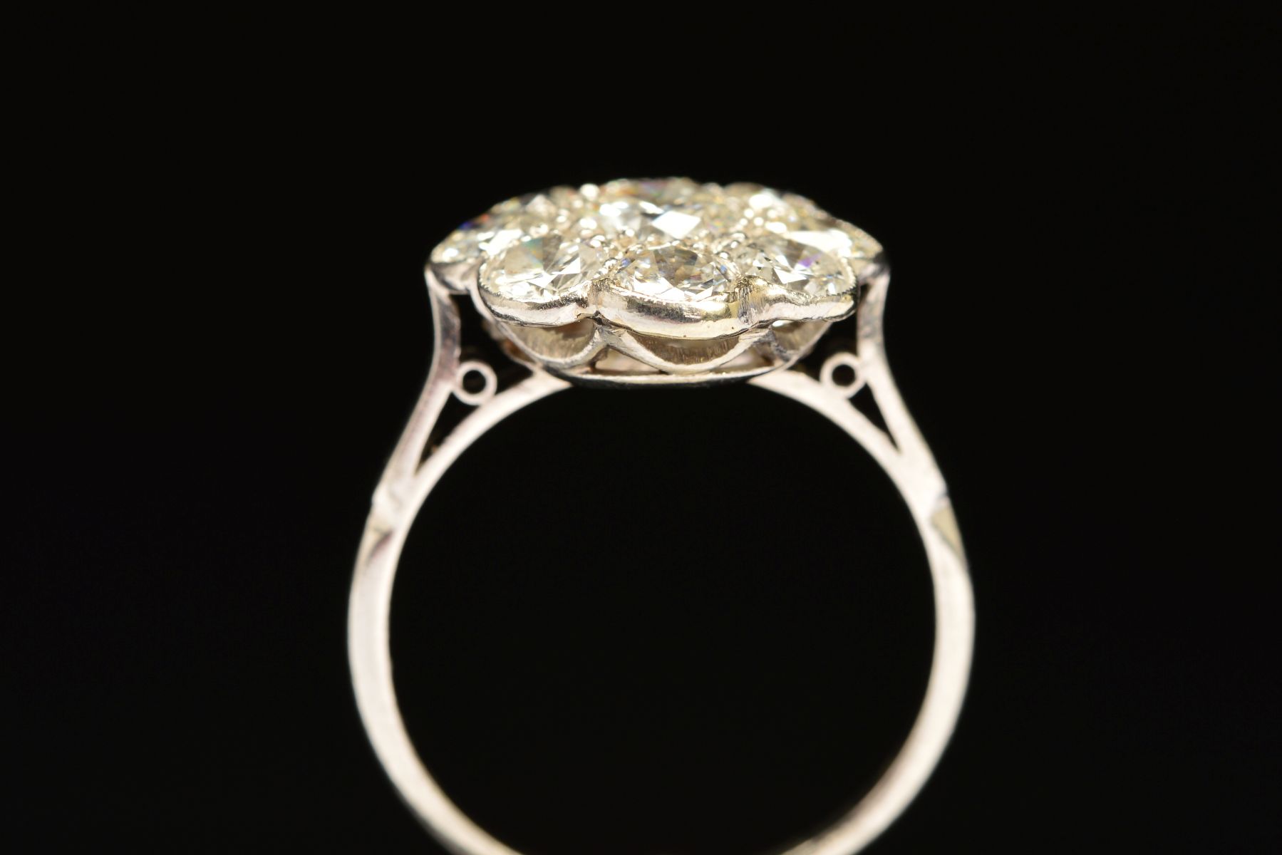 A DIAMOND CLUSTER RING, the central brilliant cut diamond within a surround of eight brilliant cut - Image 5 of 5