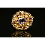 A GOLD AMETHYST AND SEED PEARL BROOCH, the central rectangular amethyst, surrounded by shell and