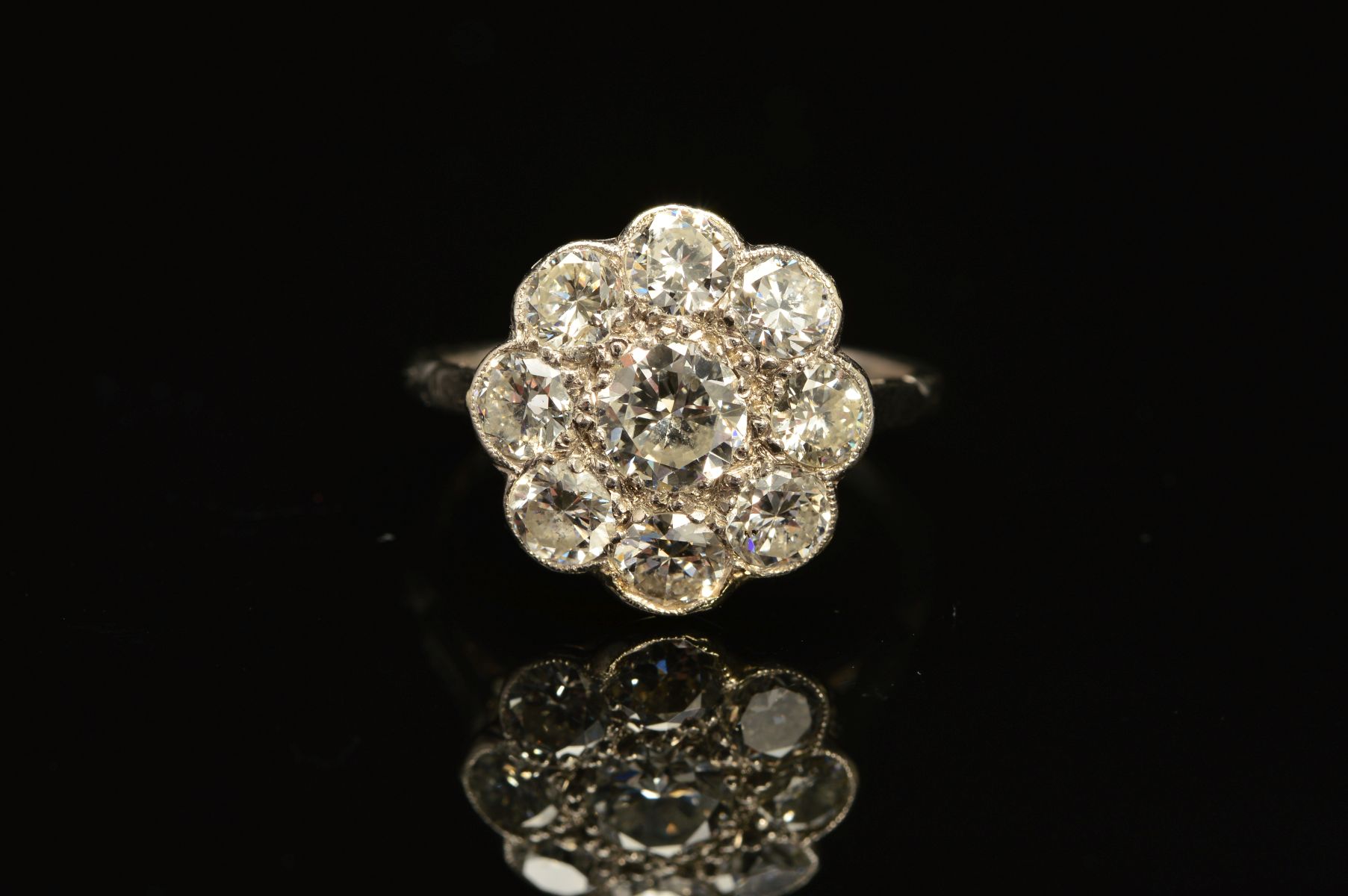 A DIAMOND CLUSTER RING, the central brilliant cut diamond within a surround of eight brilliant cut - Image 2 of 5