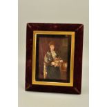 A LATE 19TH/EARLY 20TH CENTURY PORTRAIT MINIATURE OF A LADY SEATED WITH A DOG ON HER LAP,