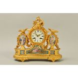 A MID 19TH CENTURY FRENCH ORMOLU AND PORCELAIN MANTEL CLOCK, cast with bird finials, circular enamel