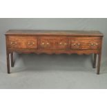 A LATE GEORGE III OAK DRESSER BASE, moulded top above three short drawers with brass swan neck