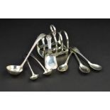 A GEORGE VI SILVER FIVE BAR TOAST RACK, of arched form on a rectangular base, makers Walker &