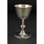 A LATE VICTORIAN SILVER PLATED COMMUNION CHALICE, concentric band decoration, knopped stem, circular