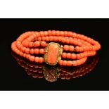 A LATE VICTORIAN THREE ROW CORAL BRACELET, rounded beads strung plain to a three row gilt coral
