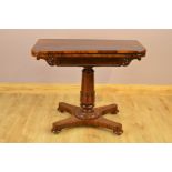 AN EARLY VICTORIAN ROSEWOOD FOLD OVER CARD TABLE, of rectangular form, rounded front corners, the