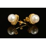 A MODERN PAIR OF 18CT GOLD YOKO CULTURED FRESH WATER PEARL AND DIAMOND STUD EARRINGS, together