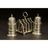 A PAIR OF VICTORIAN SILVER PEPPERETTES, of lighthouse shape, knopped finials, bayonet fitting