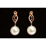 A PAIR OF 18CT GOLD CULTURED PEARL AND DIAMOND DROP EARRINGS, each designed as a spherical