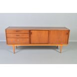 A NATHAN 1960’S TEAK SIDEBOARD, flanked by three graduated drawers and double sliding doors, on four