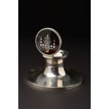 A GEORGE V SILVER CAPSTAN INKWELL, the hinged cover with tortoiseshell and pique work inlay of