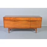 A 1960’S TEAK SIDEBOARD, with one long and two short drawers with walnut fronts above a fall front