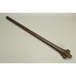 A FIJIAN ROOTSTOCK WAR CLUB, with shallow carved grip decoration to the lower shaft, length 107cm (