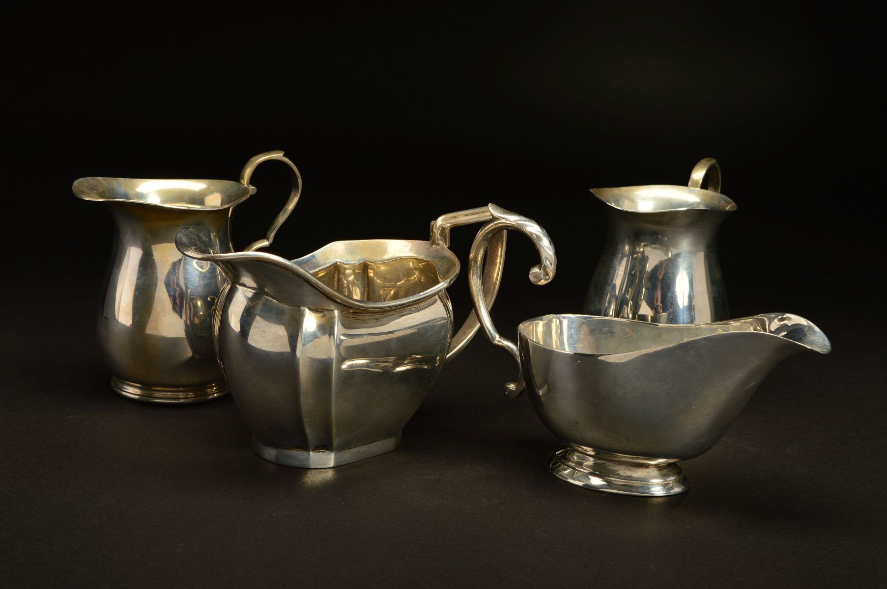 A PAIR OF GEORGE VI SILVER BALUSTER CREAM JUGS, 'S' scroll handles, makers James Dixon & Sons Ltd,