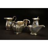 A PAIR OF GEORGE VI SILVER BALUSTER CREAM JUGS, 'S' scroll handles, makers James Dixon & Sons Ltd,