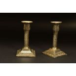 A PAIR OF EDWARDIAN SILVER DWARF CANDLESTICKS, the removable sconces with beaded rims above