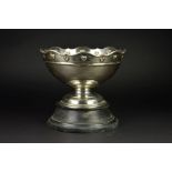 AN EDWARDIAN SILVER ROSE BOWL, the wavy rim above a border of embossed hearts and a raised