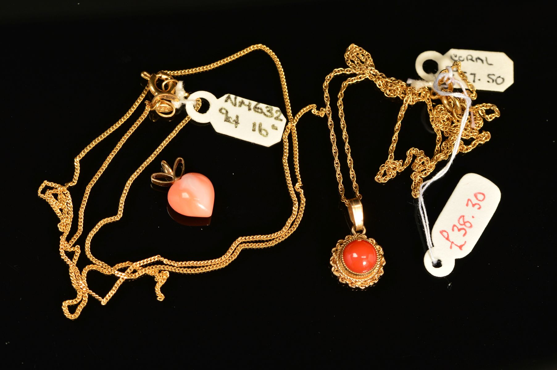 TWO MODERN SMALL CORAL PENDANTS, a heart and a round panel within a twist rope edge border, both