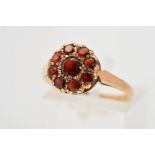 A 9CT GOLD GARNET CLUSTER RING, designed as a cluster of circular garnets, with 9ct hallmark for