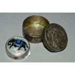 TWO 20TH CENTURY INDIAN WHITE METAL PILL BOXES, of circular form, one enamelled and with an elephant