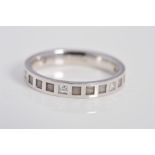 A MODERN 18CT WHITE GOLD DIAMOND SET BAND, square cross section with square embossed panels and