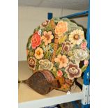 A NOVELTY FIREGUARD, shaped as a basket of flowers, height 47cm, together with a pair of bellows (