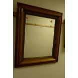 AN EARLY 20TH CENTURY OAK FRAMED WALL MIRROR 60cm x 70cm together with a pine bevelled edge mirror