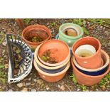 A COLLECTION OF TERRACOTTA AND GLAZED POTS together with three metal hanging semi circle baskets (
