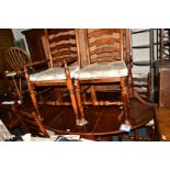 A REPRODUCTION OAK OVAL TOPPED DROP LEAF TABLE, with a single drawer, and four rush seated ladder