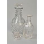 TWO EARLY 19TH CENTURY GLASS DECANTERS, one triple ringed neck, mushroom shaped stopper, approximate