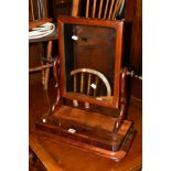 AN EARLY VICTORIAN FLAME MAHOGANY TOILET MIRROR