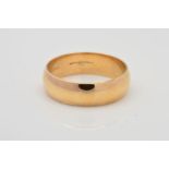 A MODERN 9CT GOLD WEDDING BAND, D shaped cross section, measuring approximately 6.0mm in width, ring