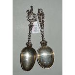 TWO DUTCH SILVER SPOONS, figural finials over twisted handles, one bowl engraved with inscription to