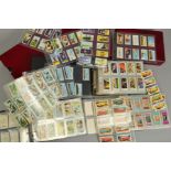A COLLECTION OF OVER TWO THOUSAND FOUR HUNDRED TRADE CARDS, in approximately 80 sets in three albums