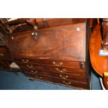 A GEORGIAN MAHOGANY FALL FRONT BUREAU, the interior revealing various satinwood front drawers and