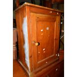 A 20TH CENTURY STAINED PITCH PINE SINGLE DOOR CUPBOARD, width 54cm x depth 31cm x height 74cm
