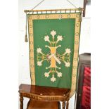 A LATE 19TH/EARLY 20TH CENTURY ECCLESIASTICAL FELT BANNER, green ground applied with a design of