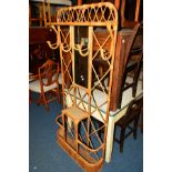 A MID 20TH CENTURY WICKER HALL STAND, with four hooks, central mirror and umbrella/walking stick