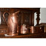 A VICTORIAN COPPER WATER JUG, a copper twin handled pan and another copper pan (3)