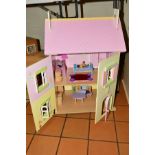 A CHILD'S DOLLS HOUSE, 'Buttercup Cottage' made by Le Toy Van, with furniture and figures