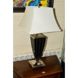 A CONTEMPORARY CHROME FRAMED TABLE LAMP by Uttermost Lighting with a square white shade, height